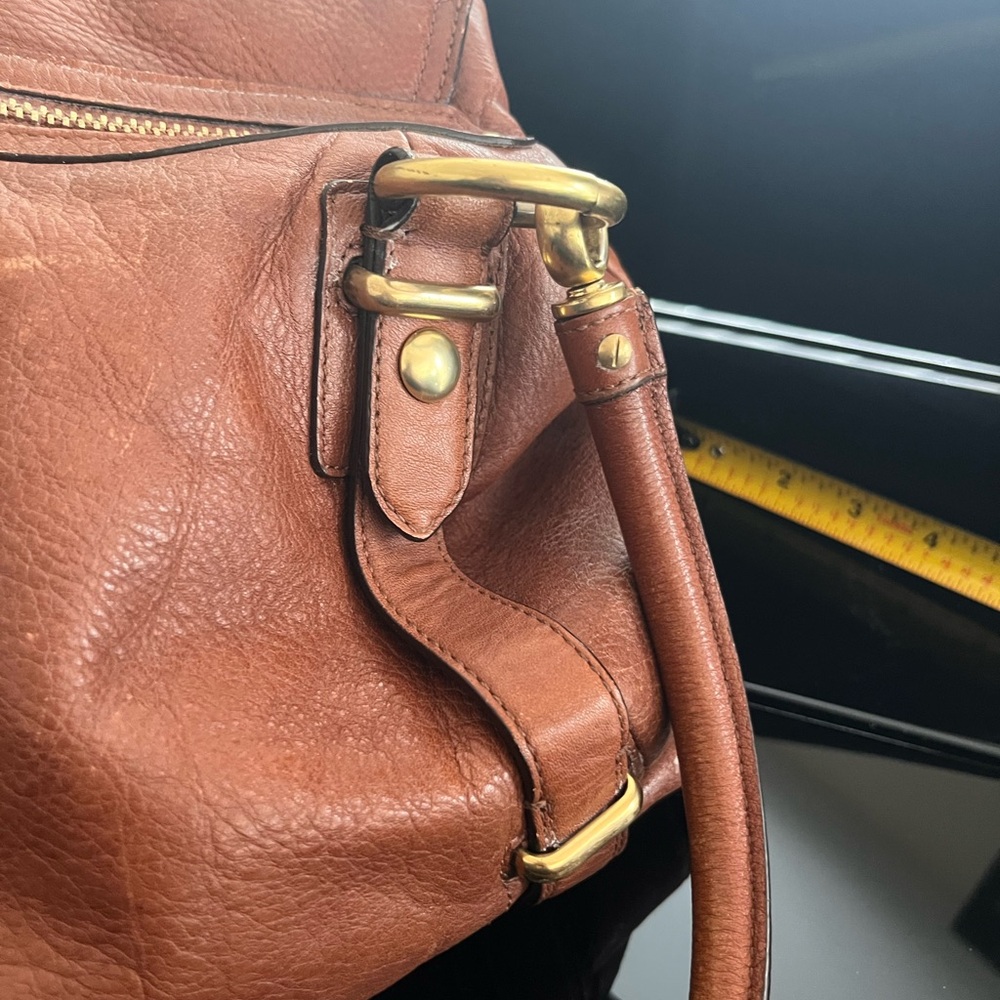 Coach Hampton Leather Carryall 15404
Brown Leather Handbag with Gold Accents - Picture 14 of 16